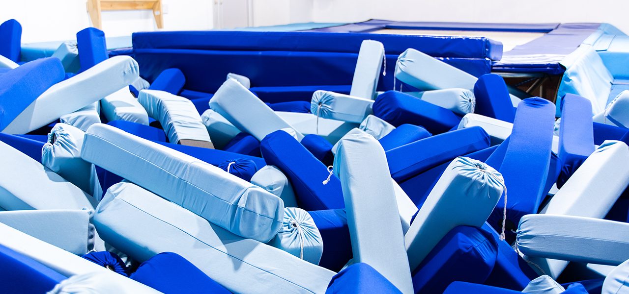 Blue foam pit blocks beneath a window