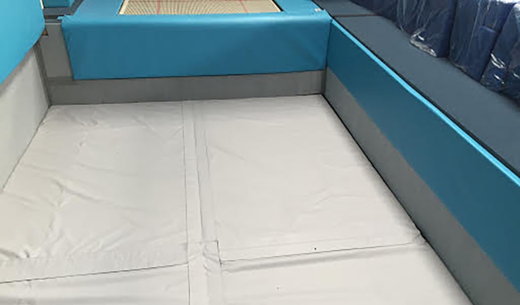 Blue perimeter padding around an empty pit