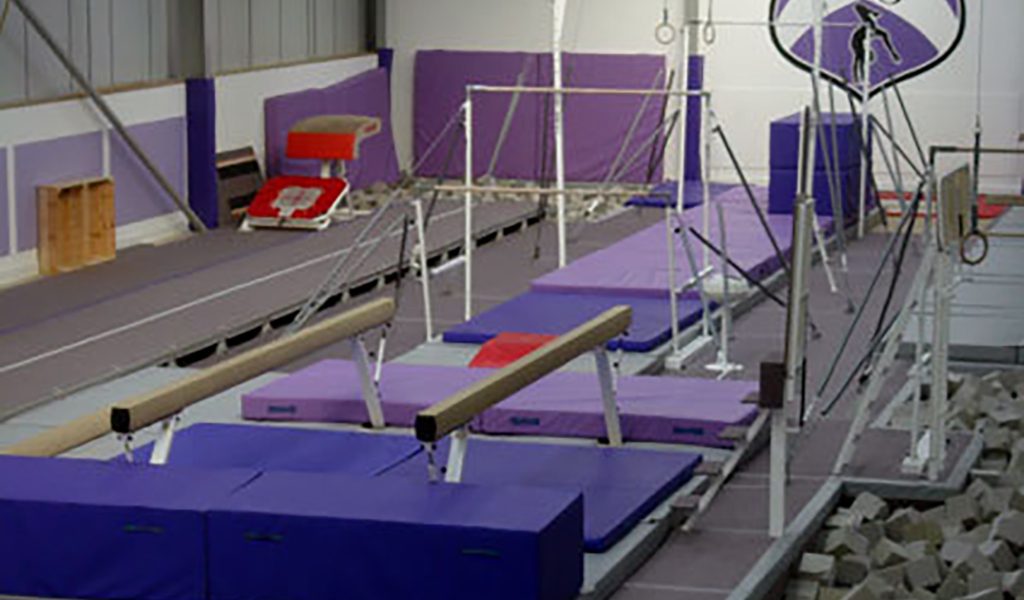 Purple matting and a foam pit in a gymnastics installation