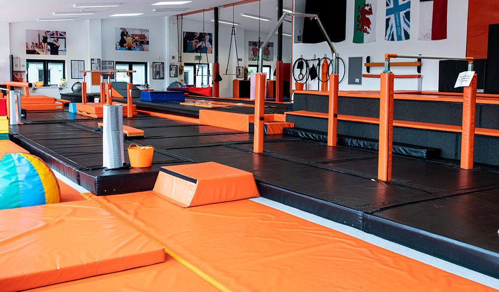 Orange gymnastics blocks and mats in a completed training space