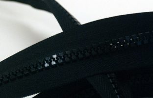 Close-up of a black zip fitted to a mat cover