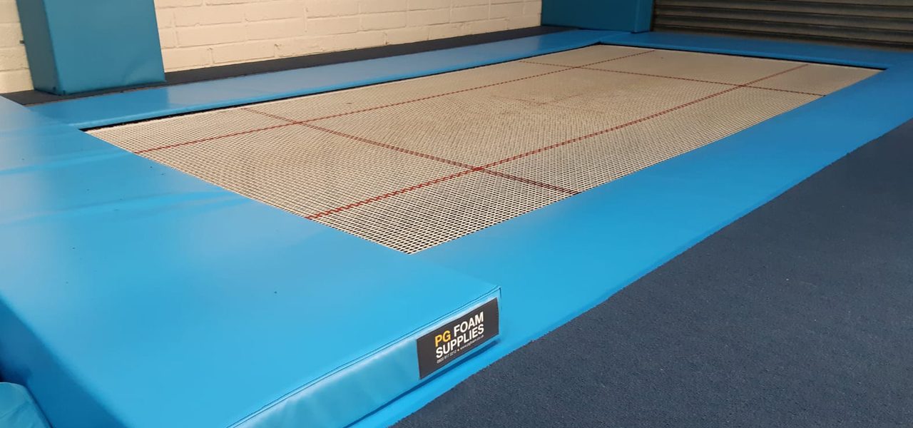 Blue padding around a recessed trampoline