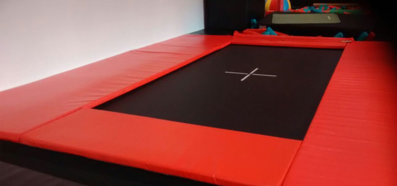 Red trampoline surround padding