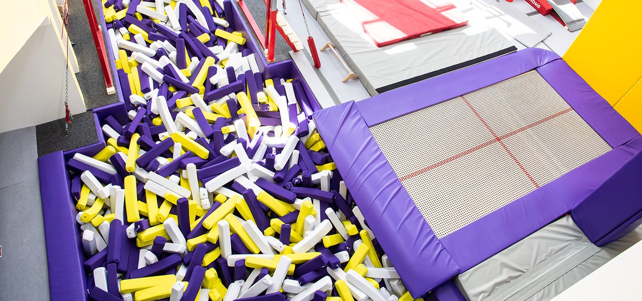 Trampoline and foam pit installation with purple matting
